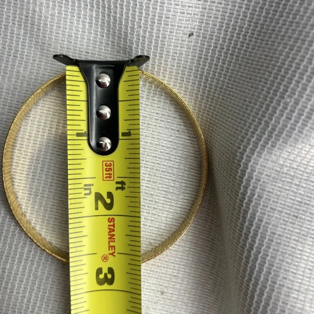 Gold Tone Heart Engraved Bangle Bracelet Measuring 2 3/4 Inches Across